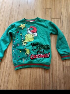 green Dr. Seuss The Grinch crewneck sweatshirt features a festive Christmas tree